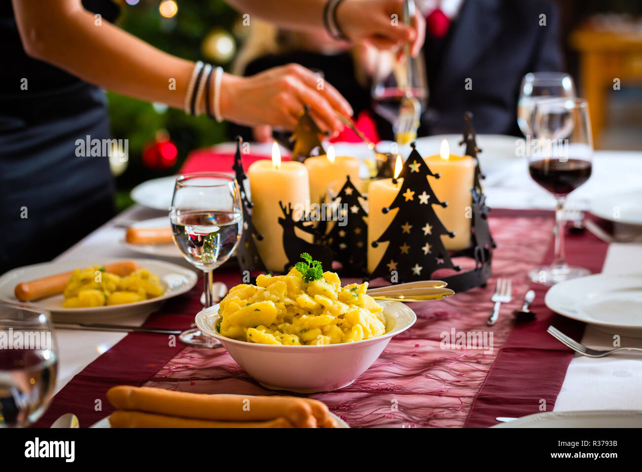 traditional german christmas dinner sausages and potato salad Stock