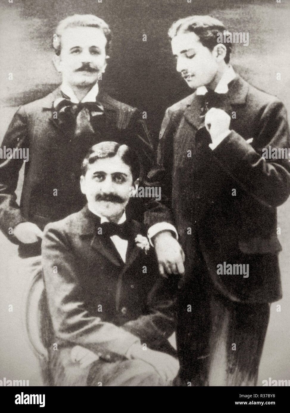 Marcel Proust (seated), Robert de Flers (left) and Lucien Daudet (right) Stock Photo