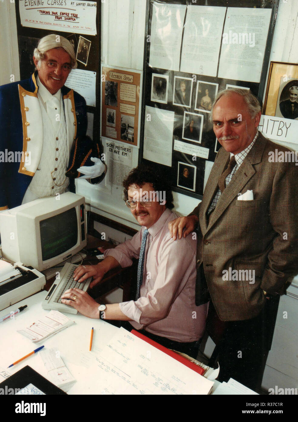 Whitby Archives & Heritage Centre(Grape,Lane, Whitby, Yorkshire UK) May 1990 - L to R  Rex Greenwood (Town crier and Dracula impersonator, in his guise as Captain Cook,), Colin Waters (Archives Founder, President and Archive Director) and Sir Michael Shaw MP (Baron Shaw of national,liberal and Member of Parliament for Scarborough and Whitby) as well as serving as an M.E.P. Stock Photo