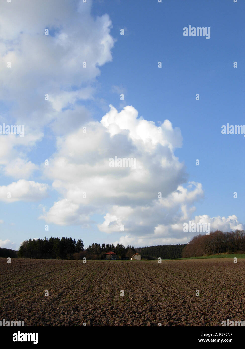 acker with house and cloudy sky Stock Photo - Alamy