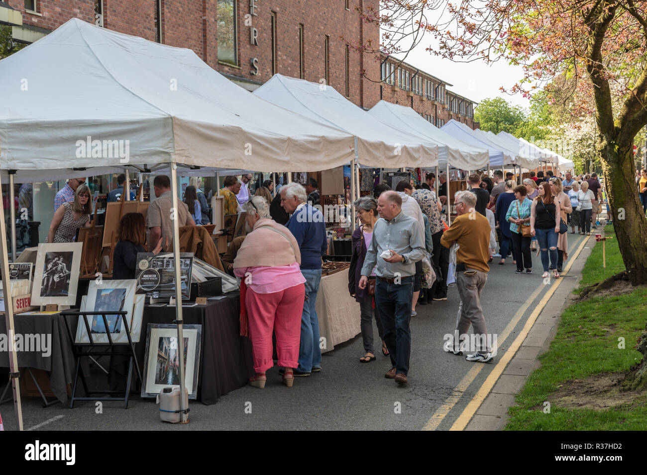 Shoppers visiting the outdoor artisan market in Wilmslow Cheshire, The