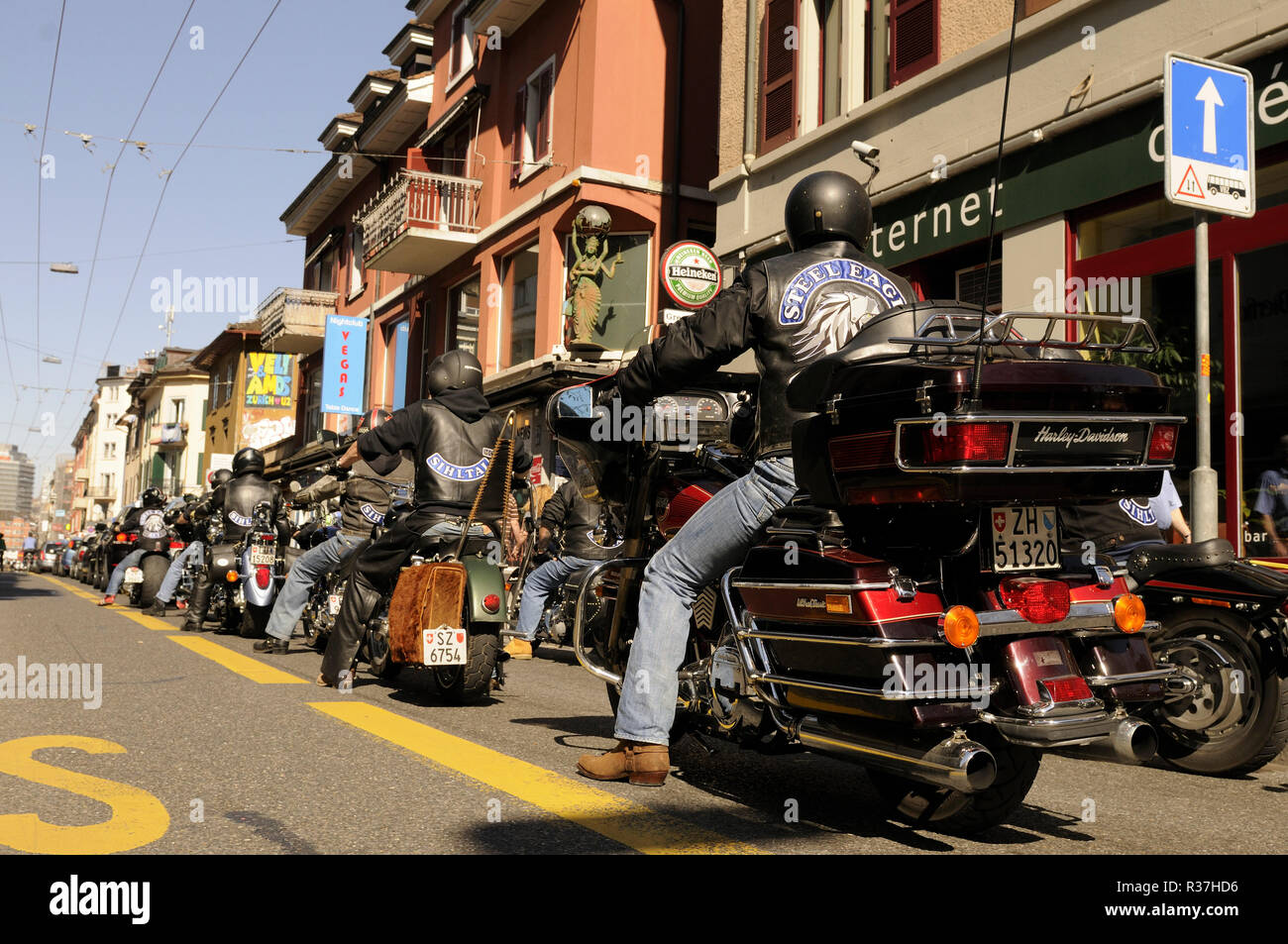 Switzerland: Hells Angels with their Harley Davisdson motor bikes driving through Longstreet of Zürich City. Stock Photo