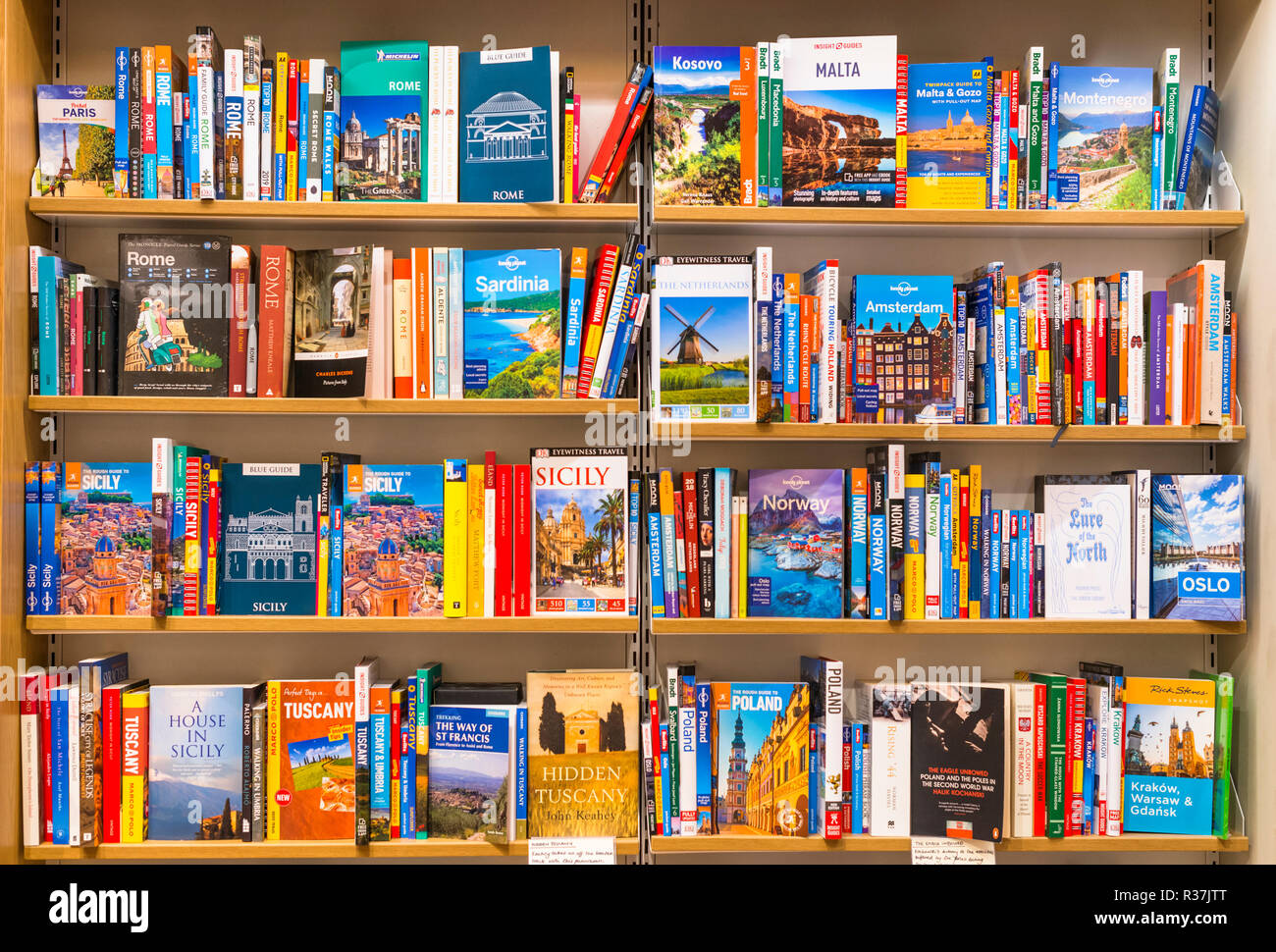 Travel guide book on sales on shelves of local Bookshop in Cambridge, England, UK Stock Photo