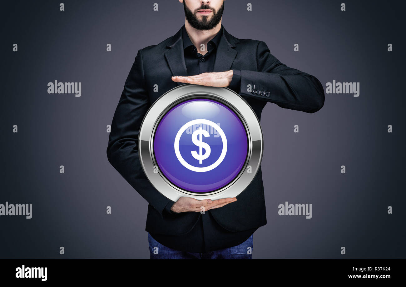 Businessman holding a circle containing the 'Dollar' pictogram Stock Photo