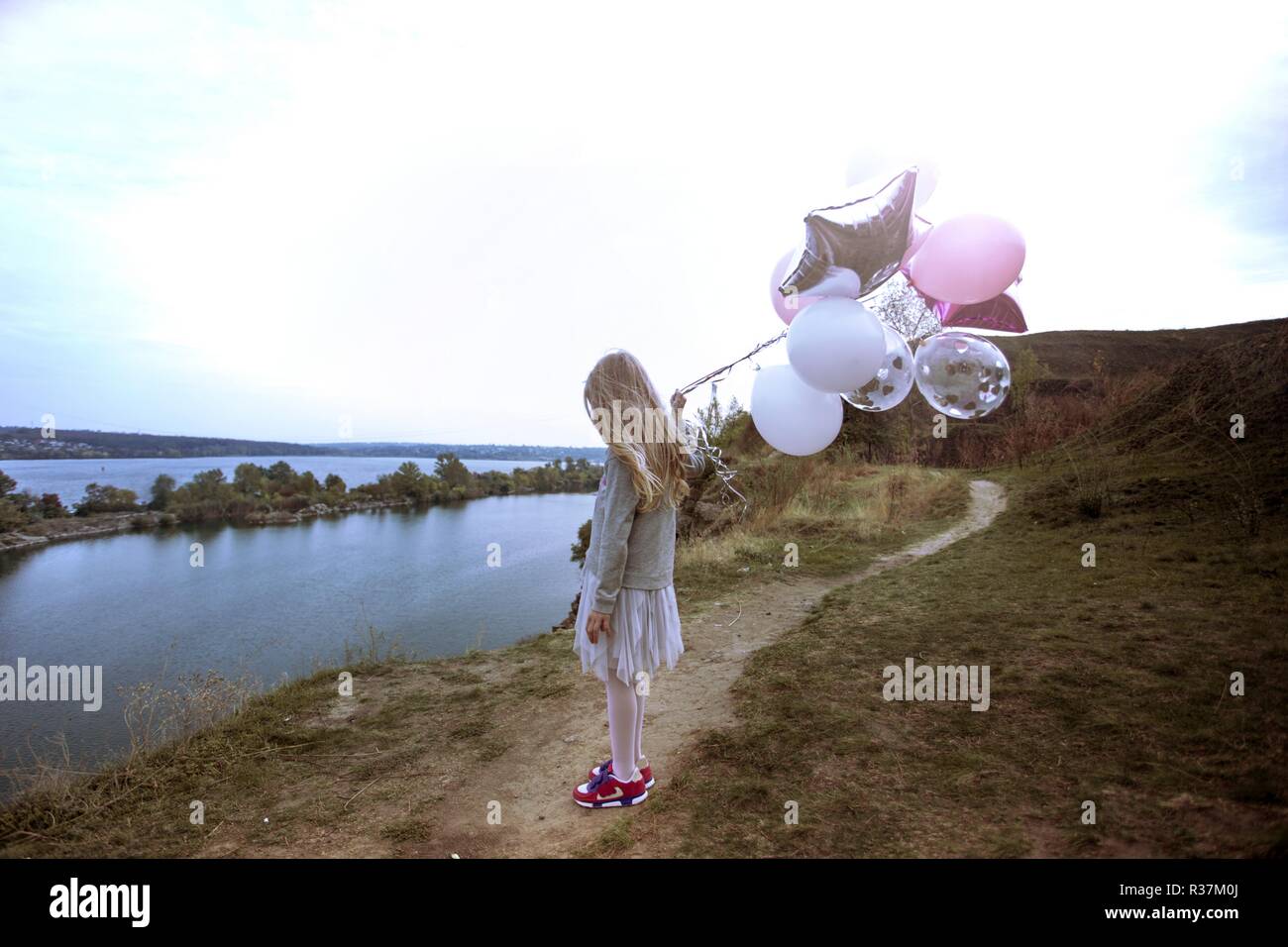 birthday - happy girl with balloons outdoor Stock Photo - Alamy