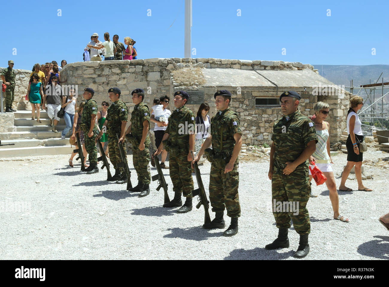 Athens, Greece, August 8: changing the guard at the flagpole with the Greek flag at the observation deck of the Acropolis of Athens August 8, 2013 in  Stock Photo