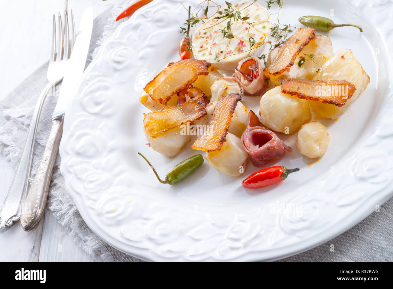 jerusalem artichoke au gratin with ham and chili Stock Photo Alamy