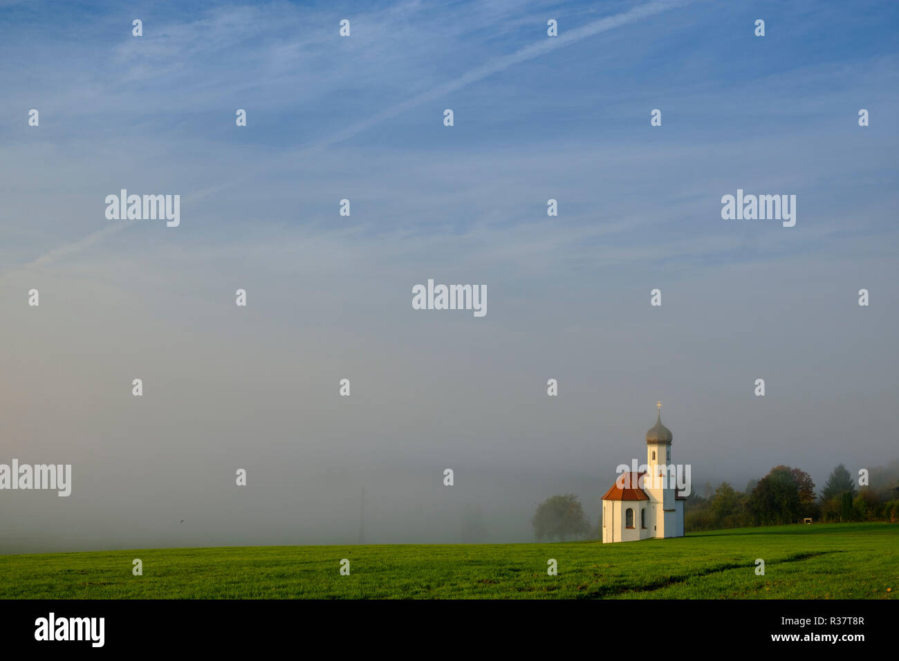 St. Johannisrain near Penzberg in the morning fog of Upper Bavaria, Bavaria, Germany Stock Photo