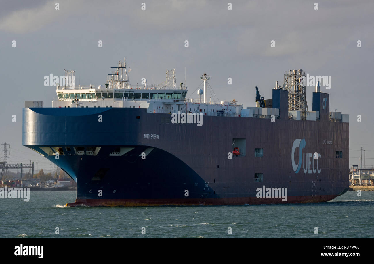 a large UECC car transporter ship or vessel in the port of southampton docks. car transporter and importing cars by sea transport. Stock Photo