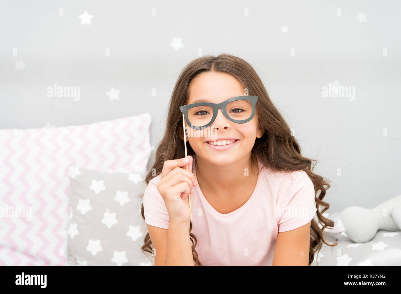 My glasses as unique as me. Happy child and childhood. Little girl hold fake glasses on face. Happy little girl. My childhood is a part of my story Stock Photo Alamy