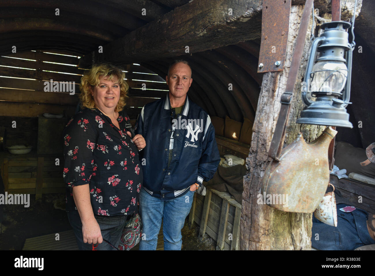 October 20, 2018 - Chattancourt, France: Portrait of Inge Mersel (L) and Mark Mersel, a Dutch couple, as they take a tour in the trench of Chattancourt. This trench near Verdun has been reconstructed by a WWI enthusiast, David Amberg, near Verdun in order to show visitors what warfare conditions were like during the First World War. La tranchee de Chattancourt, pres de Verdun, est une reproduction d'une tranchee typique de la Premiere Guerre mondiale. Des visites sont organisees afin que le public puisse realiser les conditions abominables de ce conflit militaire. Lors de certaines occasions,  Stock Photo