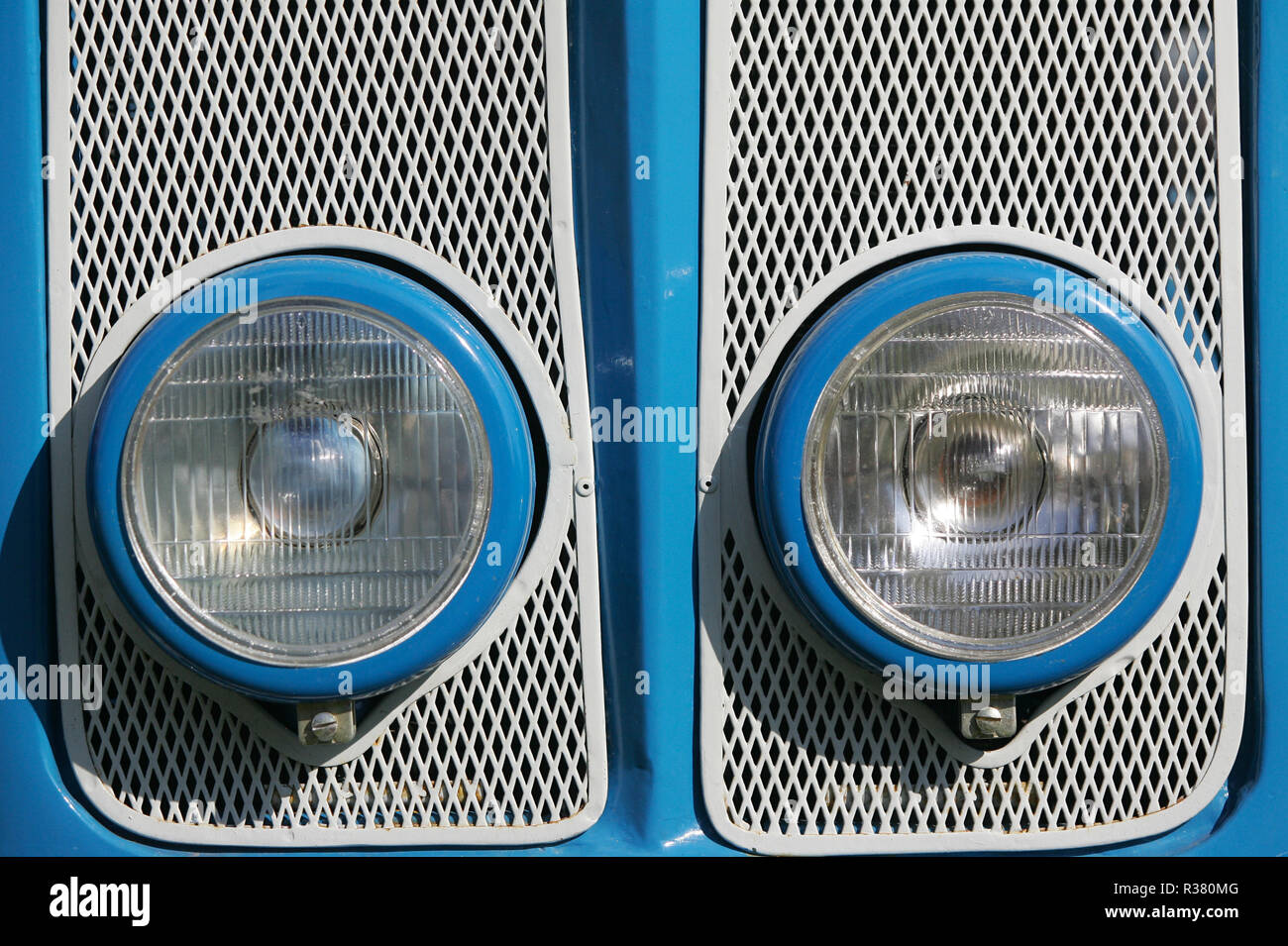 Headlights of an old Super Dexta tractor on display at a country fair. England UK GB Stock Photo