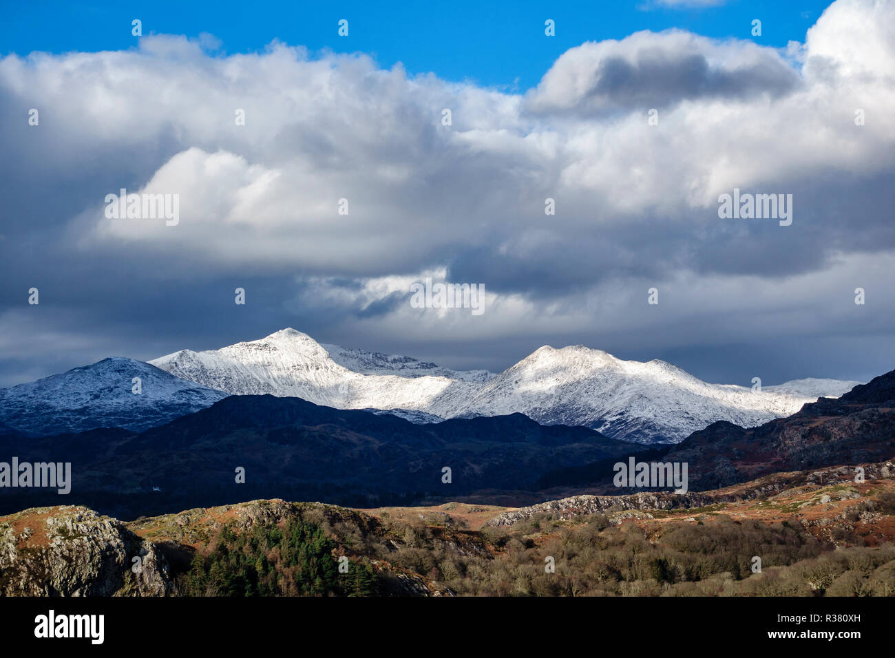 Snowdonia National Park, North Wales, UK. View of the snow covered Mt Snowdon from the Plas Brondanw estate near Portmeirion Stock Photo