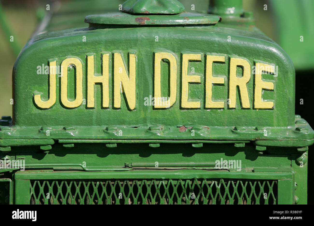 A John Deere tractor and emblem on display at a country fair. England ...