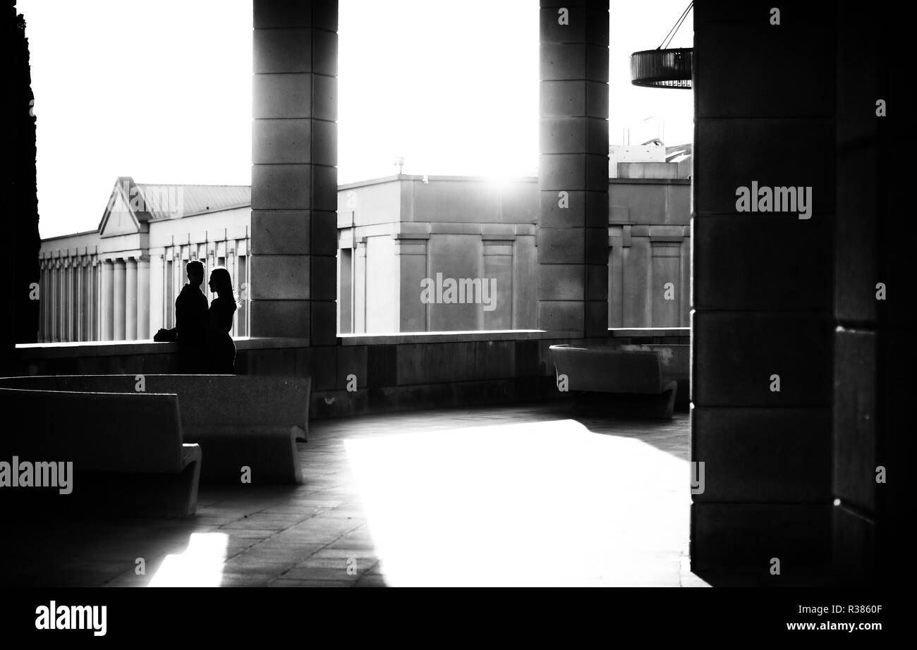 Backlit couple in Barcelona Stock Photo