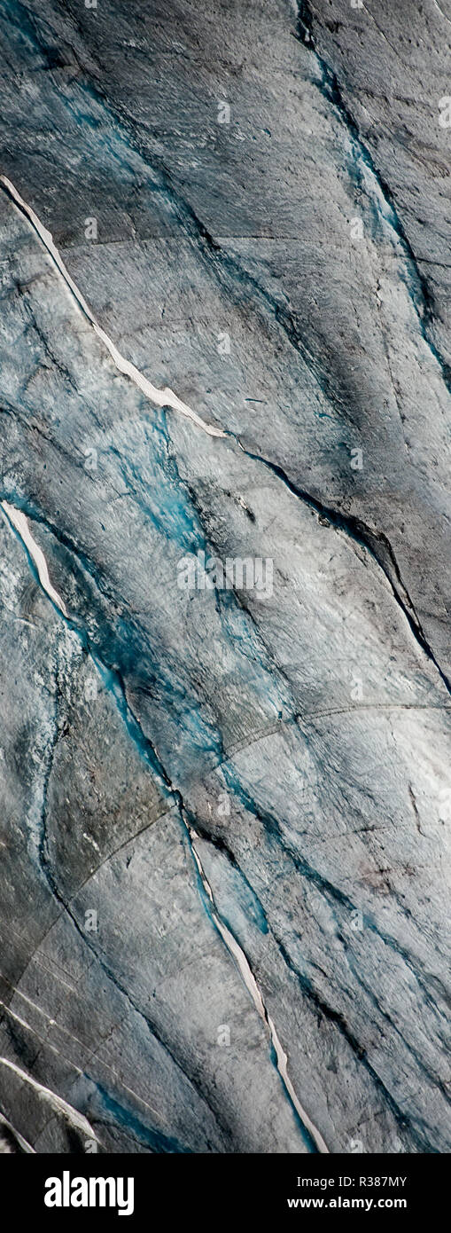 Amazing variations of blue on this aerial image of Tunsbergdalsbreen, Norway's longest glacier arm of the Jostedalsbreen ice cap. Tunsbergdalsbreen is Stock Photo