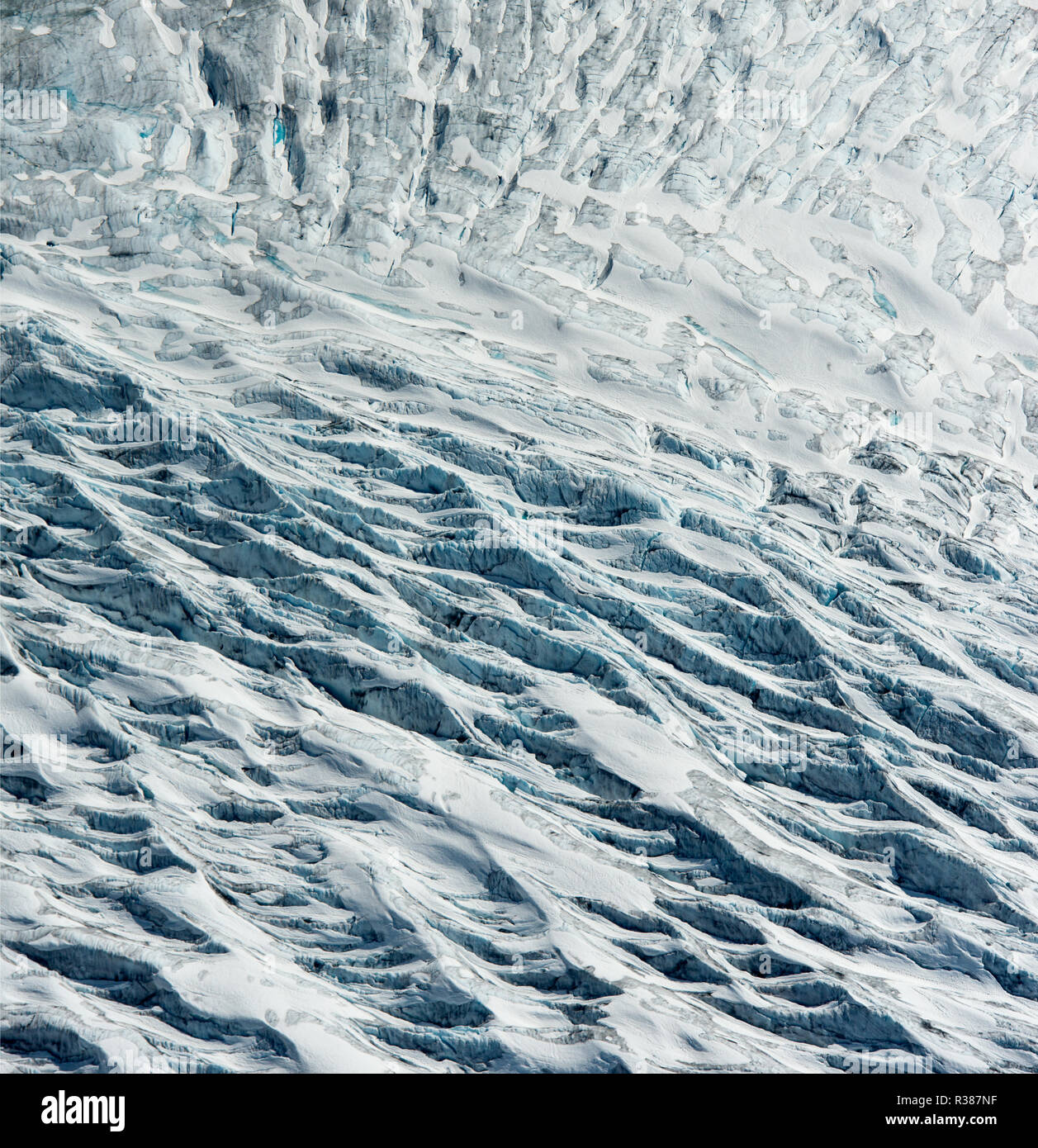 Amazing aerial detail of the Tunsbergdalsbreen glacier, showing the debris and moraine streams going down the glacier.  Tunsbergdalsbreen is a glacier Stock Photo