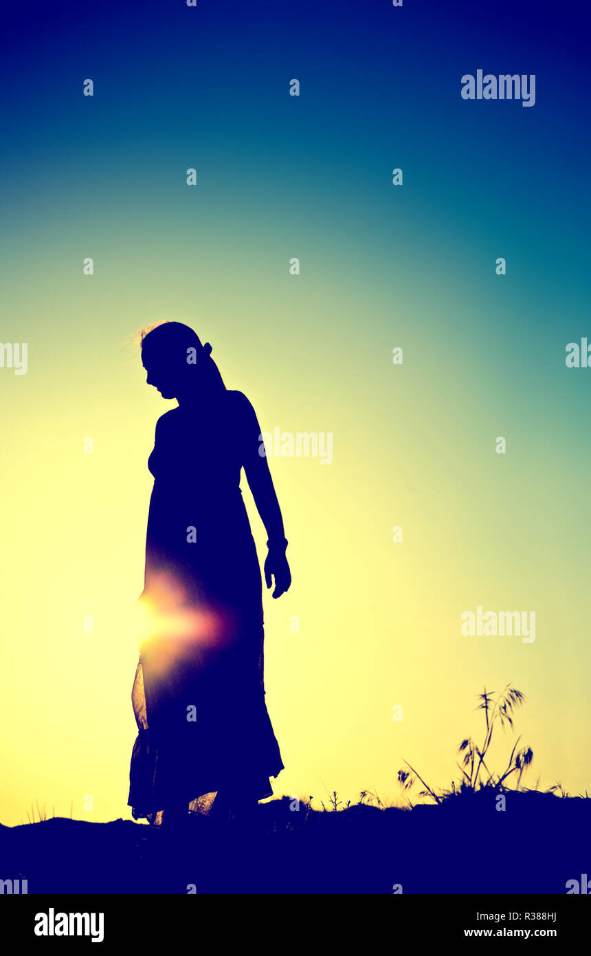 woman silhouette in front of a sunset Stock Photo - Alamy