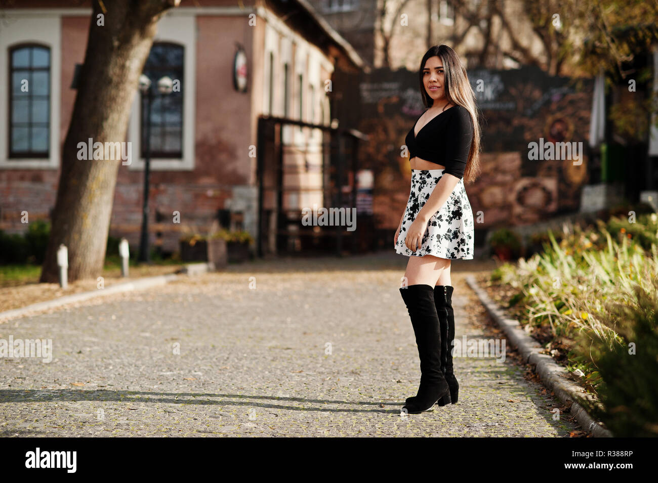 Pretty latino model girl from Ecuador wear on black tops and skirt posed at  street Stock Photo - Alamy