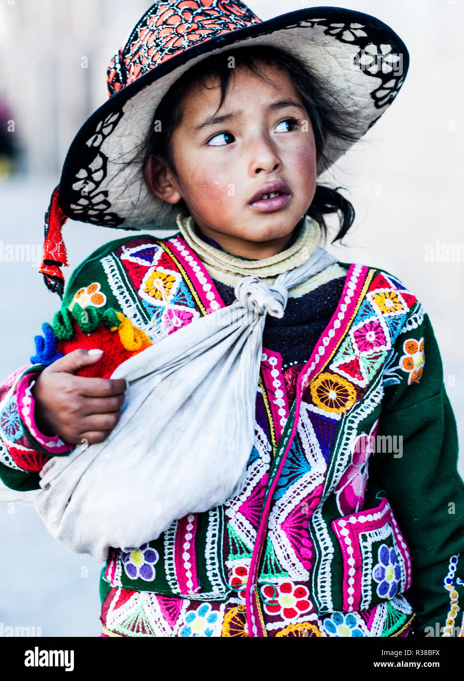 Peruvian girl in traditional dress a posing for a photo in Cusco , Peru,           South America. Stock Photo