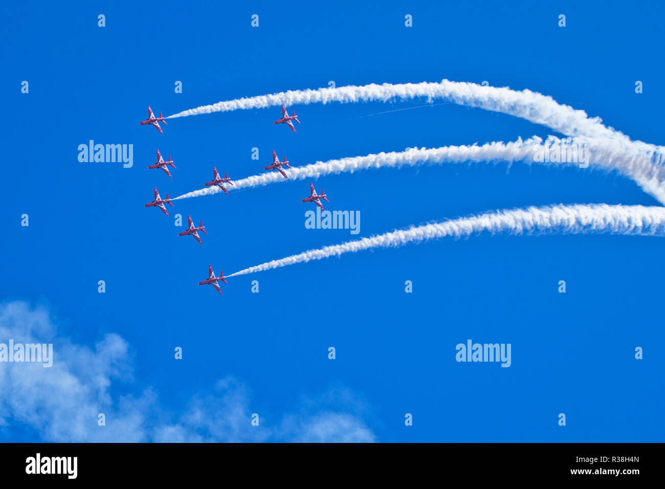 The Red Arrows, officially known as the Royal Air Force Aerobatic Team, is the aerobatics display team of the Royal Air Force based at RAF Scampton. Stock Photo