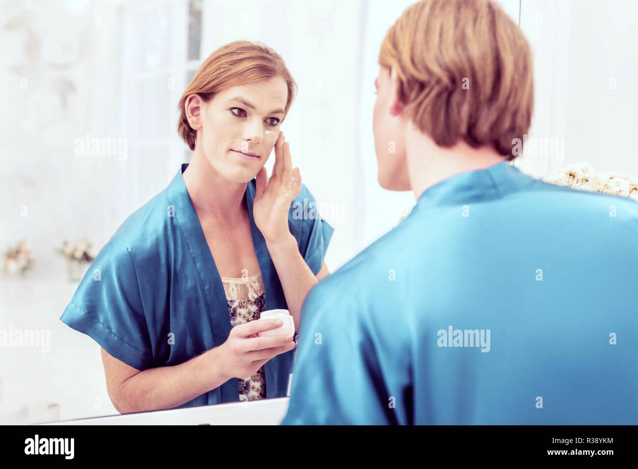 Attractive good-looking trans male having peaceful evening at home Stock Photo