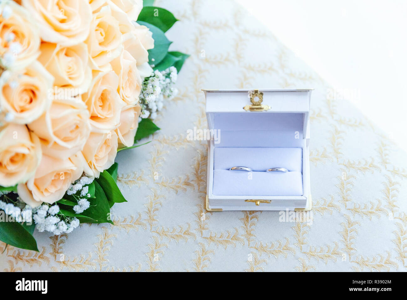 Beautiful Wedding Rings On Jewelry Box Lie On Light Surface