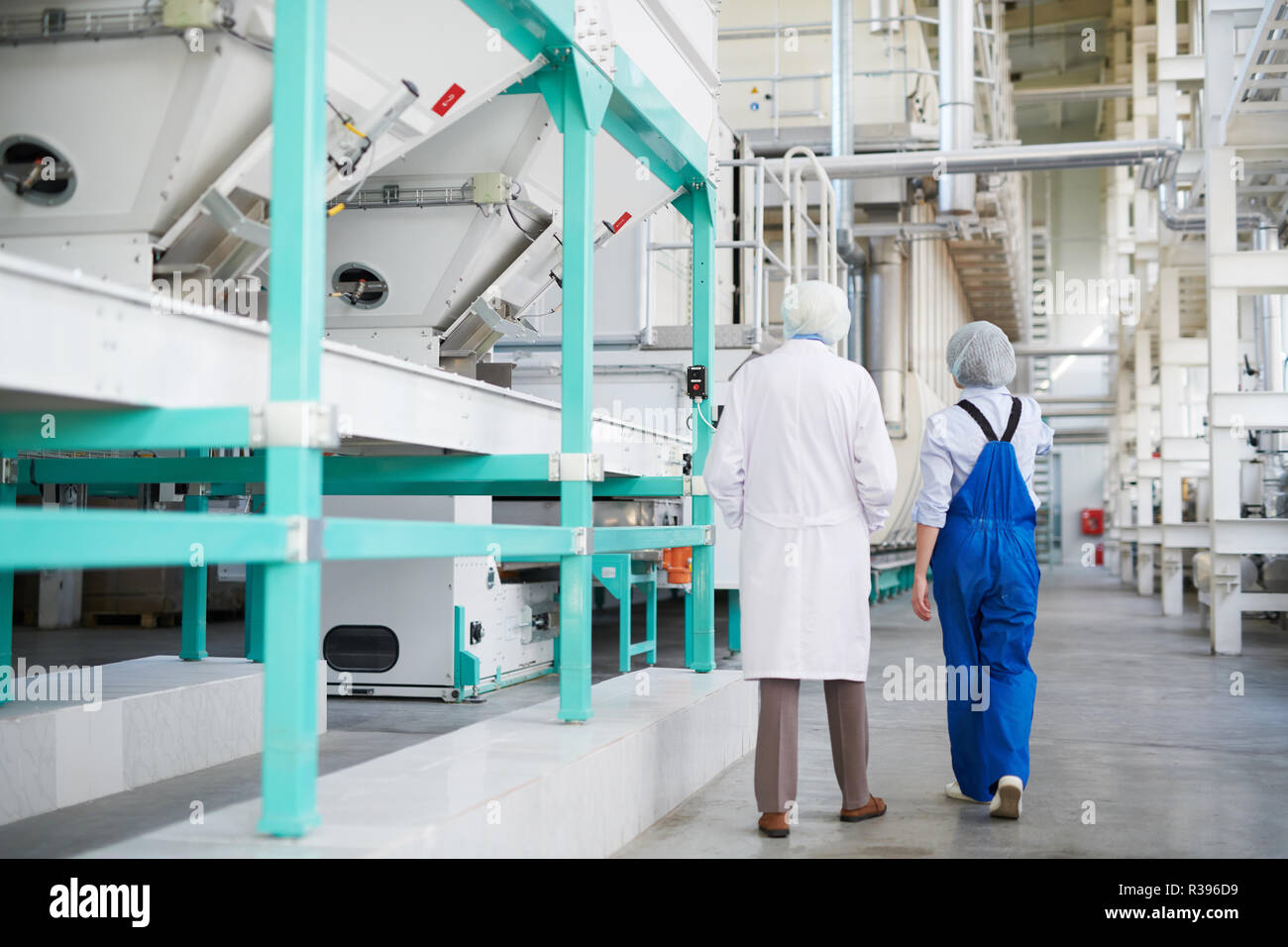 Factory Workers Back View Stock Photo