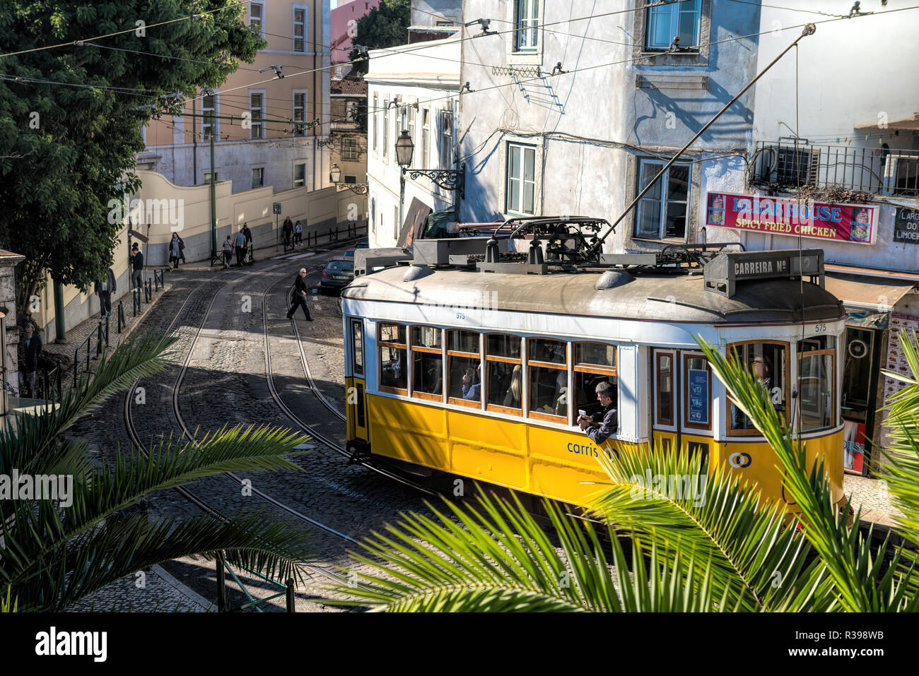 Street view with famous retro tourist tram in the old town of Lisbon city, Portugal Stock Photo