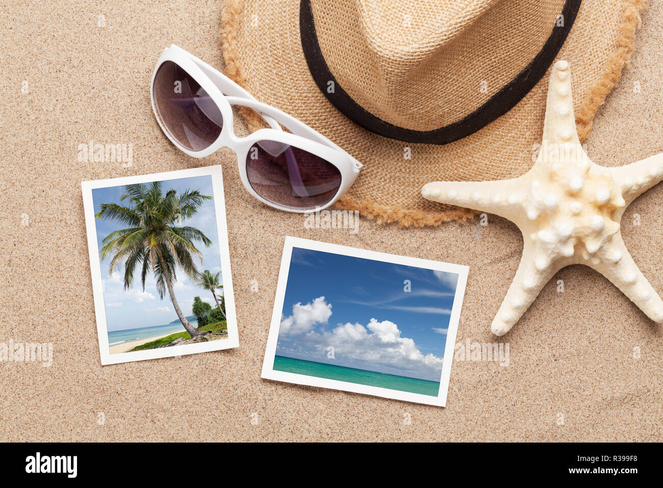 Travel vacation concept with hat, sunglasses, seashells and photos on sand backdrop. Top view with copy space. Flat lay. All photos taken by me Stock Photo