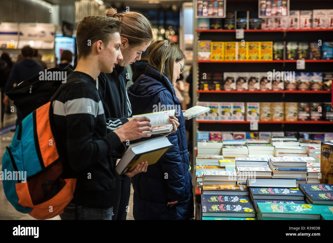 Ljubljana, Slovenia. 21th November 2018. Visitors looking and reading books at 34th Slovenian book fair which brings more than 300 events, featuring more than a hundred publishers and 25,000 books, including 3,000 new titles. The fair is annually visited by around 35,000 book lovers. Credit: Matic Štojs Lomovšek/Alamy Live News Stock Photo
