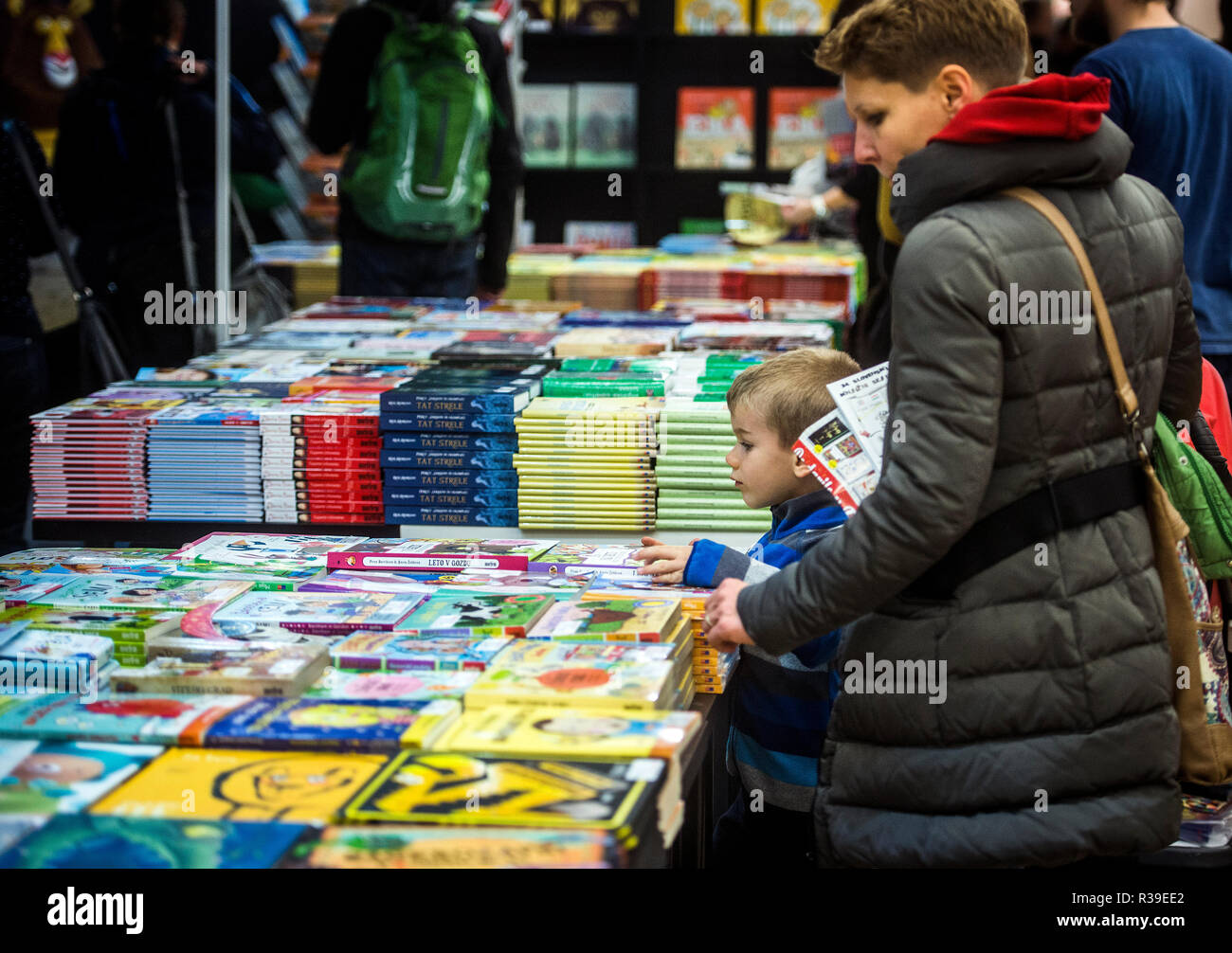 Ljubljana, Slovenia. 21th November 2018. Visitors looking and reading books at 34th Slovenian book fair which brings more than 300 events, featuring more than a hundred publishers and 25,000 books, including 3,000 new titles. The fair is annually visited by around 35,000 book lovers. Credit: Matic Štojs Lomovšek/Alamy Live News Stock Photo