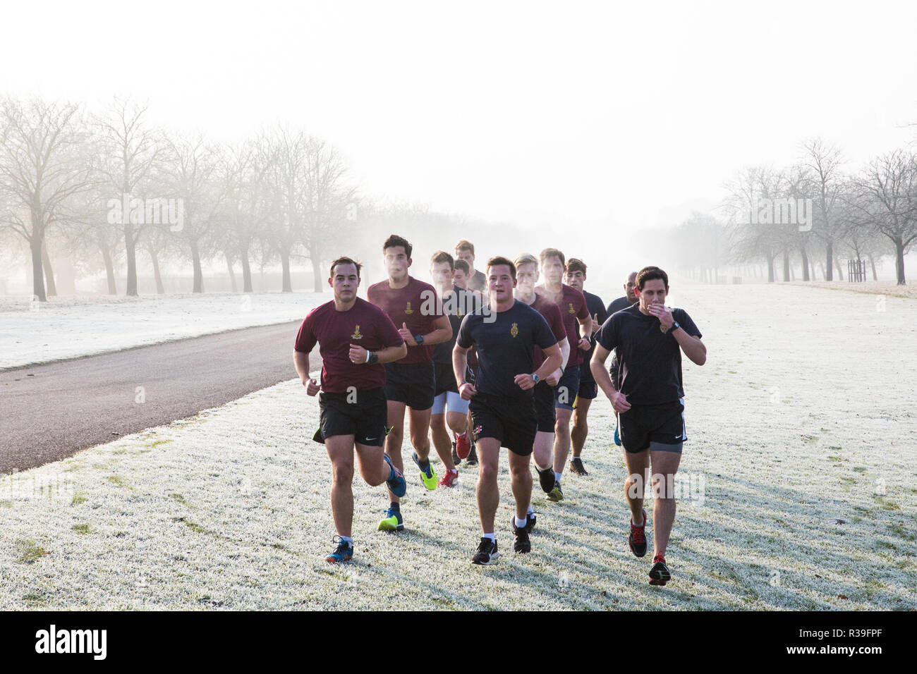 Windsor, UK. 22nd November, 2018. Soldiers train in heavy frost and foggy conditions alongside the Long Walk in Windsor Great Park. After the coldest night since February, there was widespread frost and freezing fog in Berkshire this morning but temperatures are expected to rise for a few days from tomorrow to more normal temperatures for November. Credit: Mark Kerrison/Alamy Live News Stock Photo