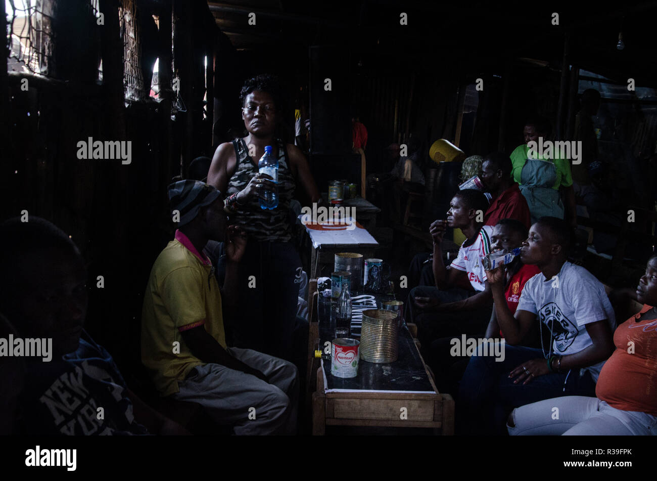 Kenya. 16th Nov, 2018. Women of kibera are seen having fun with alcoholic drinks at a local bar.For a long period of time, most women from Kibera slums have been under the influence of Alcohol. Not considering the side effects, women here consume it for different reasons including taking over stress and forgetting about their family problems back home. This is due to lack of enough job opportunities and support from their husbands.The high level of alcohol consumption has led to higher rate of deaths, blindness, and risk of many dangerous diseases such as cancer, hypertension, stroke and Stock Photo