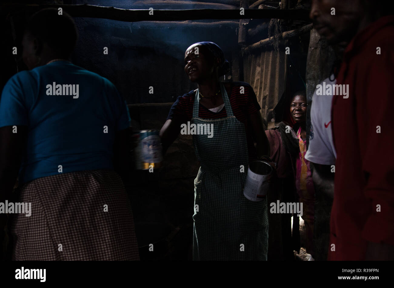 Kenya. 14th Nov, 2018. Women are seen at a local bar selling alcohol in kibera.For a long period of time, most women from Kibera slums have been under the influence of Alcohol. Not considering the side effects, women here consume it for different reasons including taking over stress and forgetting about their family problems back home. This is due to lack of enough job opportunities and support from their husbands.The high level of alcohol consumption has led to higher rate of deaths, blindness, and risk of many dangerous diseases such as cancer, hypertension, stroke and traumatic injuri Stock Photo