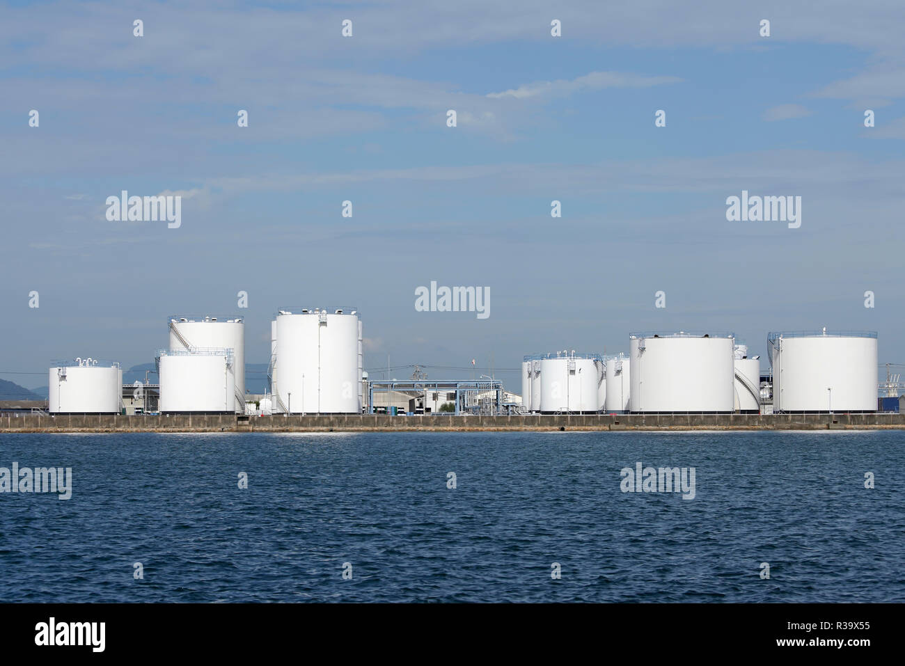 Industrial fuel storage tanks against the blue sky Stock Photo - Alamy