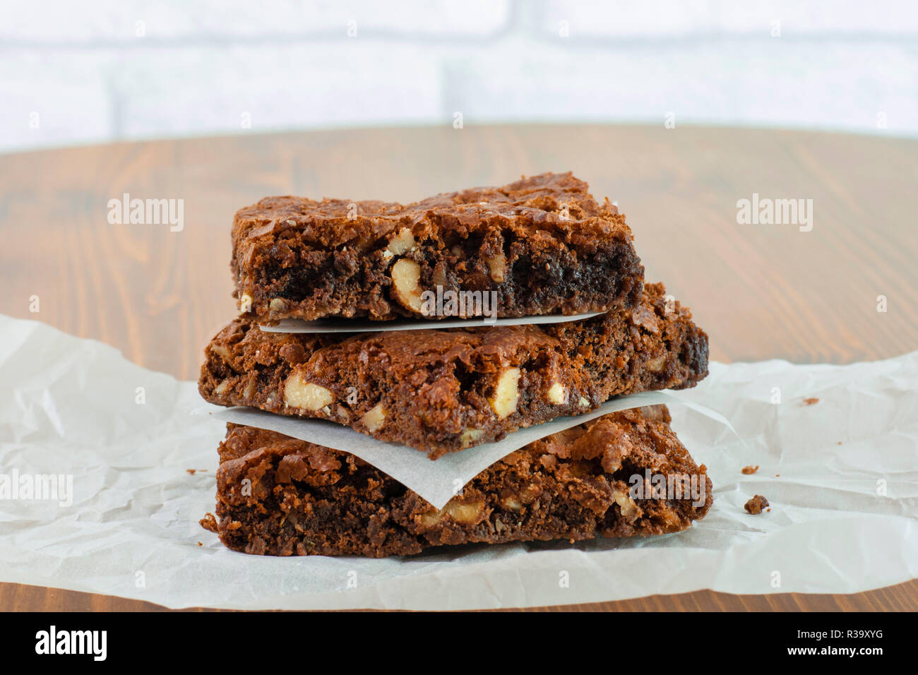 Sliced delicious brownie with hot chocolate melting sauce on it. Stock Photo