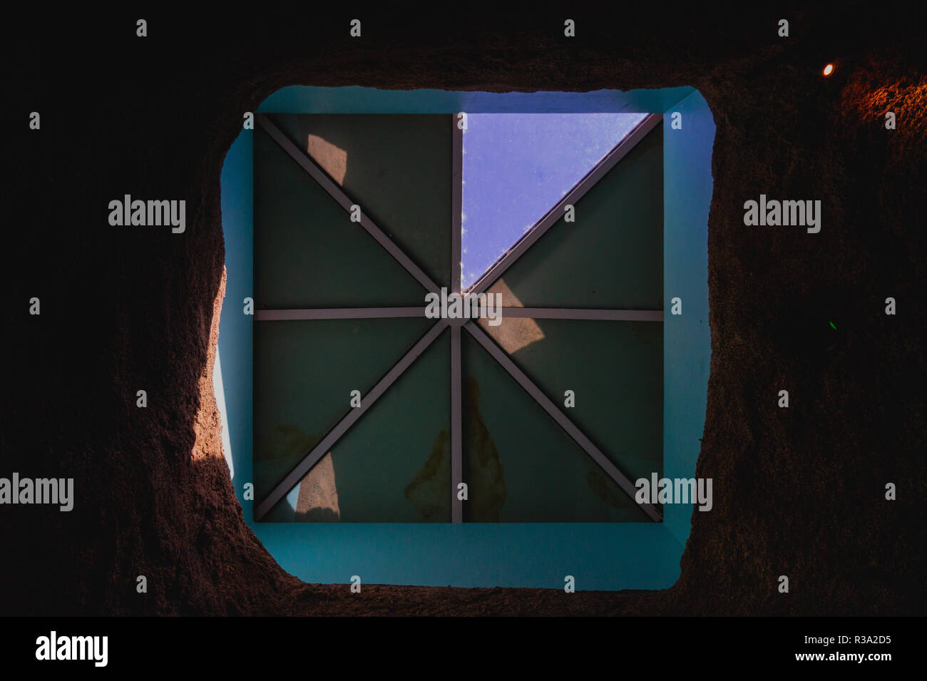 looking up through a skylight with only one window open Stock Photo