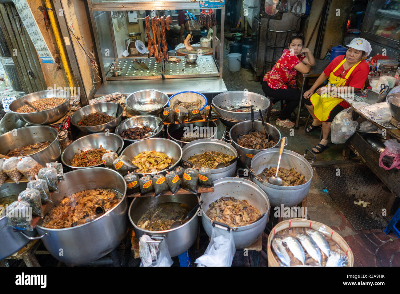 Ladies seen selling food in Chinatown, Bangkok, Thailand. Daily life in Bangkok capital of Thailand. Stock Photo