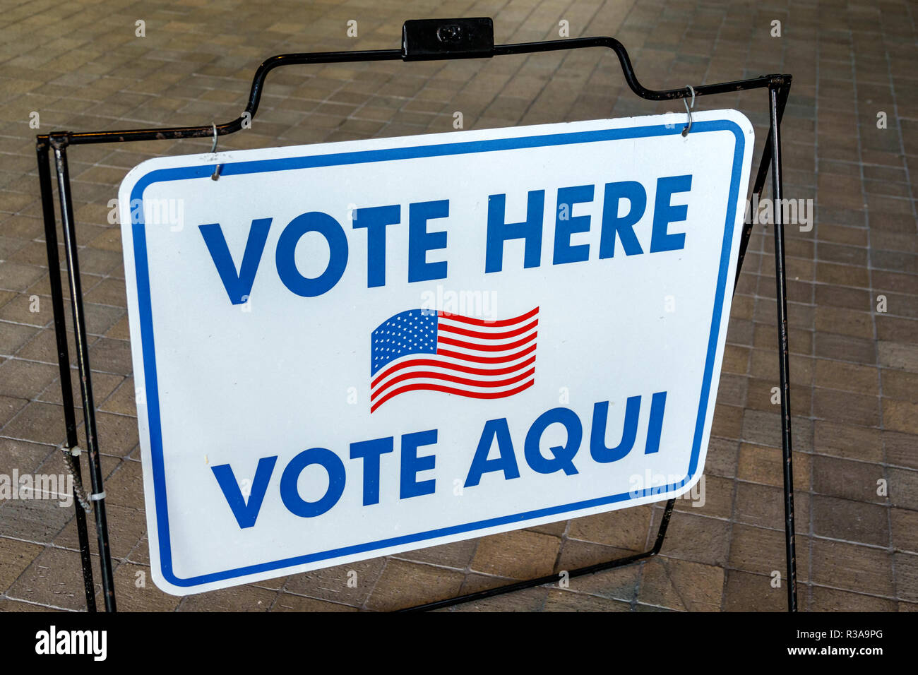 Miami Beach Florida,City Hall,sign,vote here Spanish English languages,FL181030039 Stock Photo