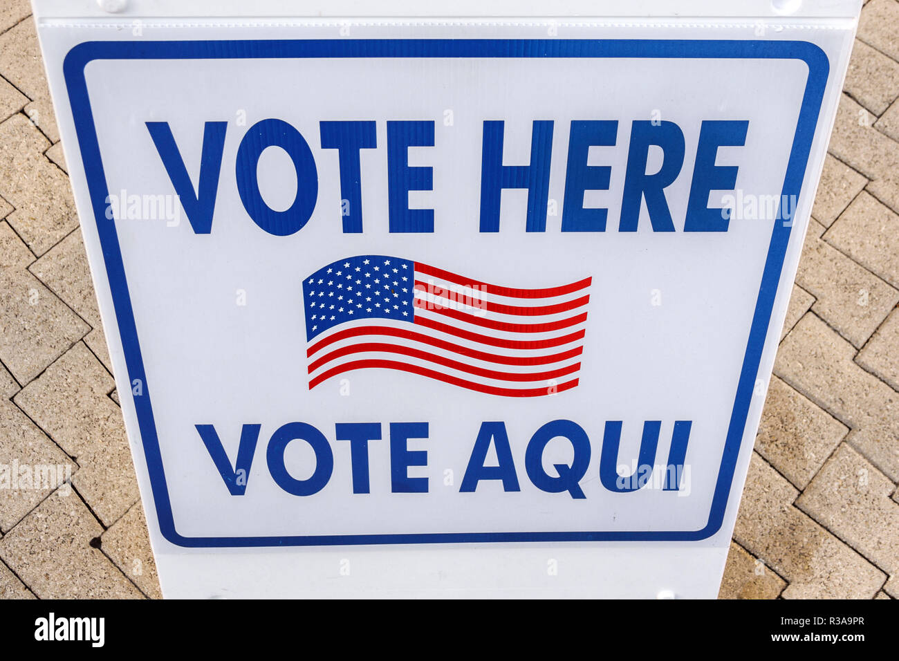 Miami Beach Florida,City Hall,sign,vote here Spanish English languages,FL181030040 Stock Photo