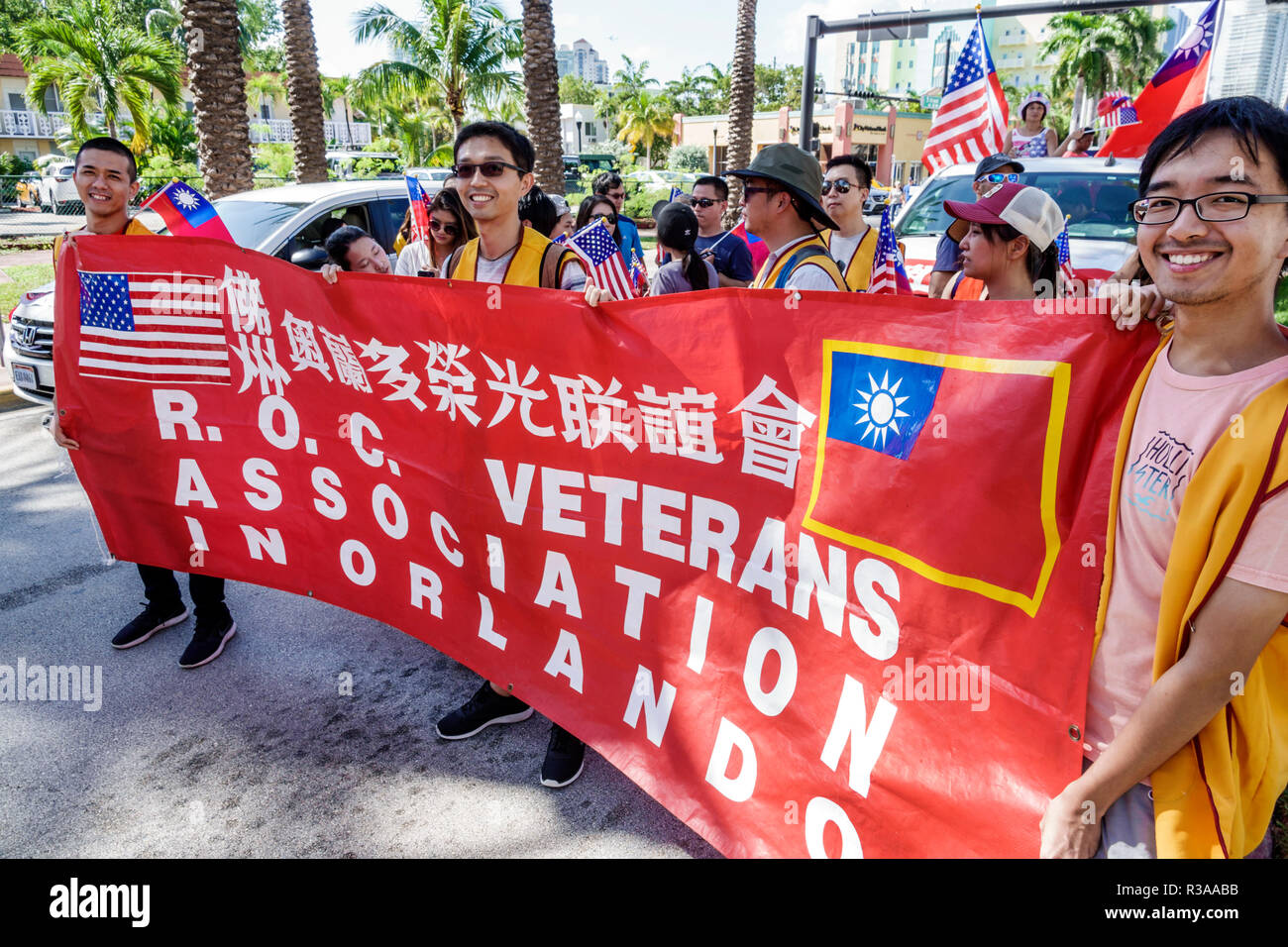 Miami Beach Florida,Ocean Drive,Veterans Day Parade activities,ROC Republic China Association,Taiwanese,Asian man men male,marching banner,FL181115039 Stock Photo