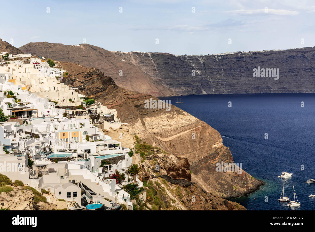 The Santorini caldera measures about 12 by 7 km (7.5 by 4.3 mi), with 300 m (980 ft) high steep cliffs on three sides. Santorini has an area of 75.8 k Stock Photo