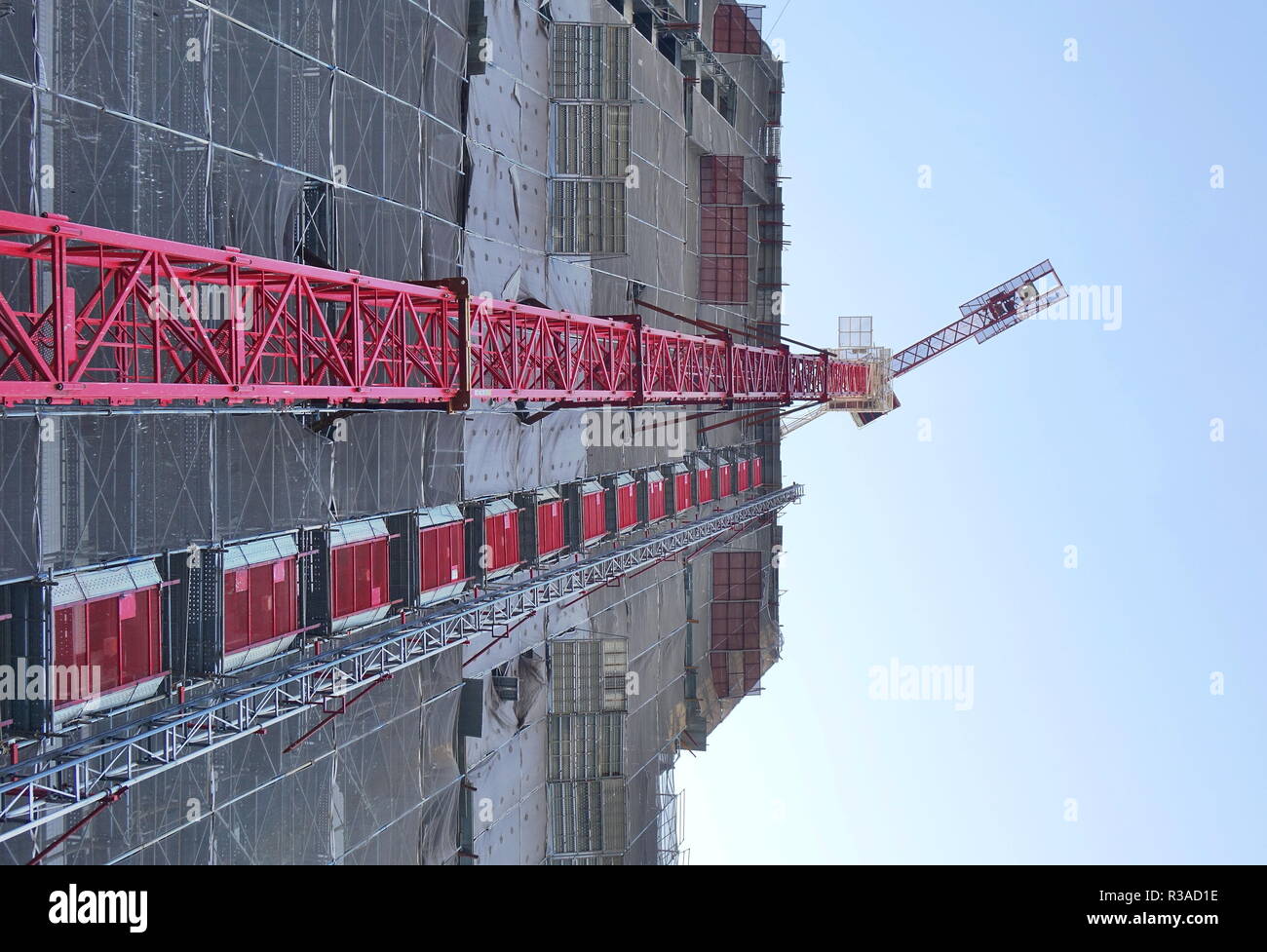 Large scale construction site with crane seen in perspective Stock