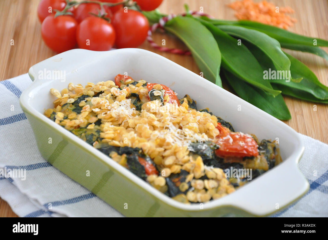 Gratin with spinach, red lentils and wild garlic Stock Photo Alamy