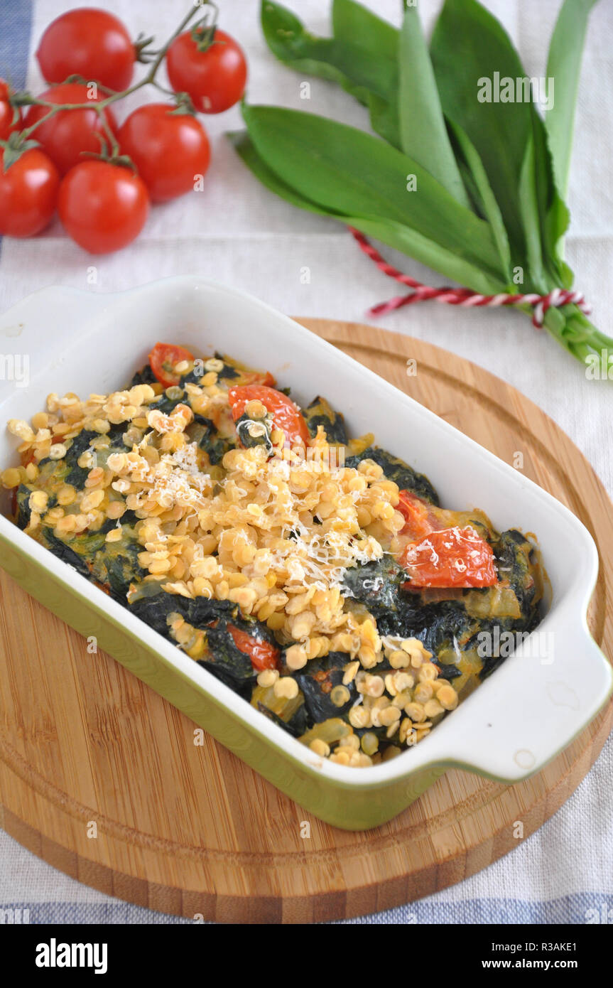 Gratin with spinach, red lentils and wild garlic Stock Photo Alamy