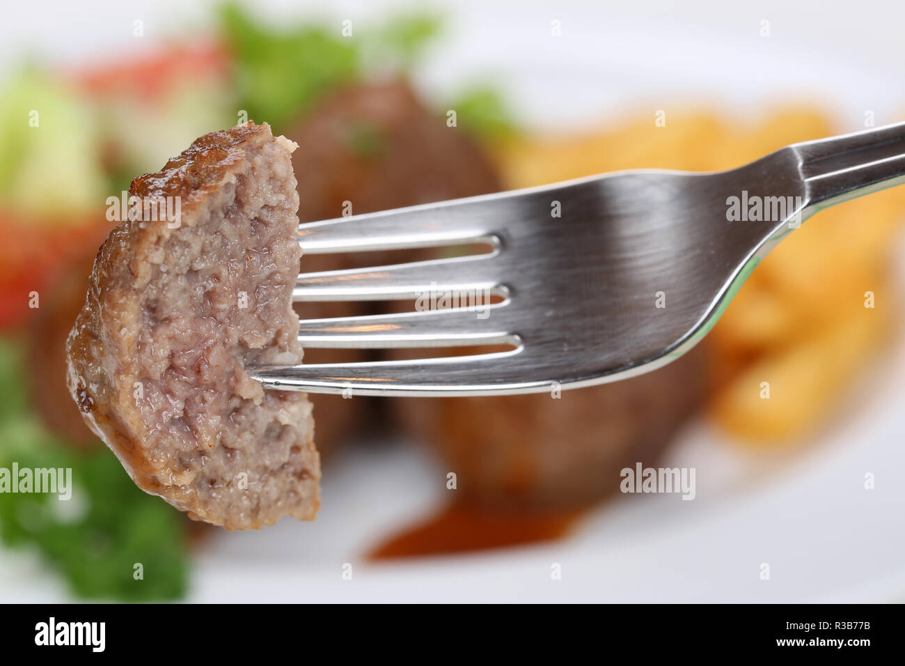 meatball or meatballs eat on a fork Stock Photo