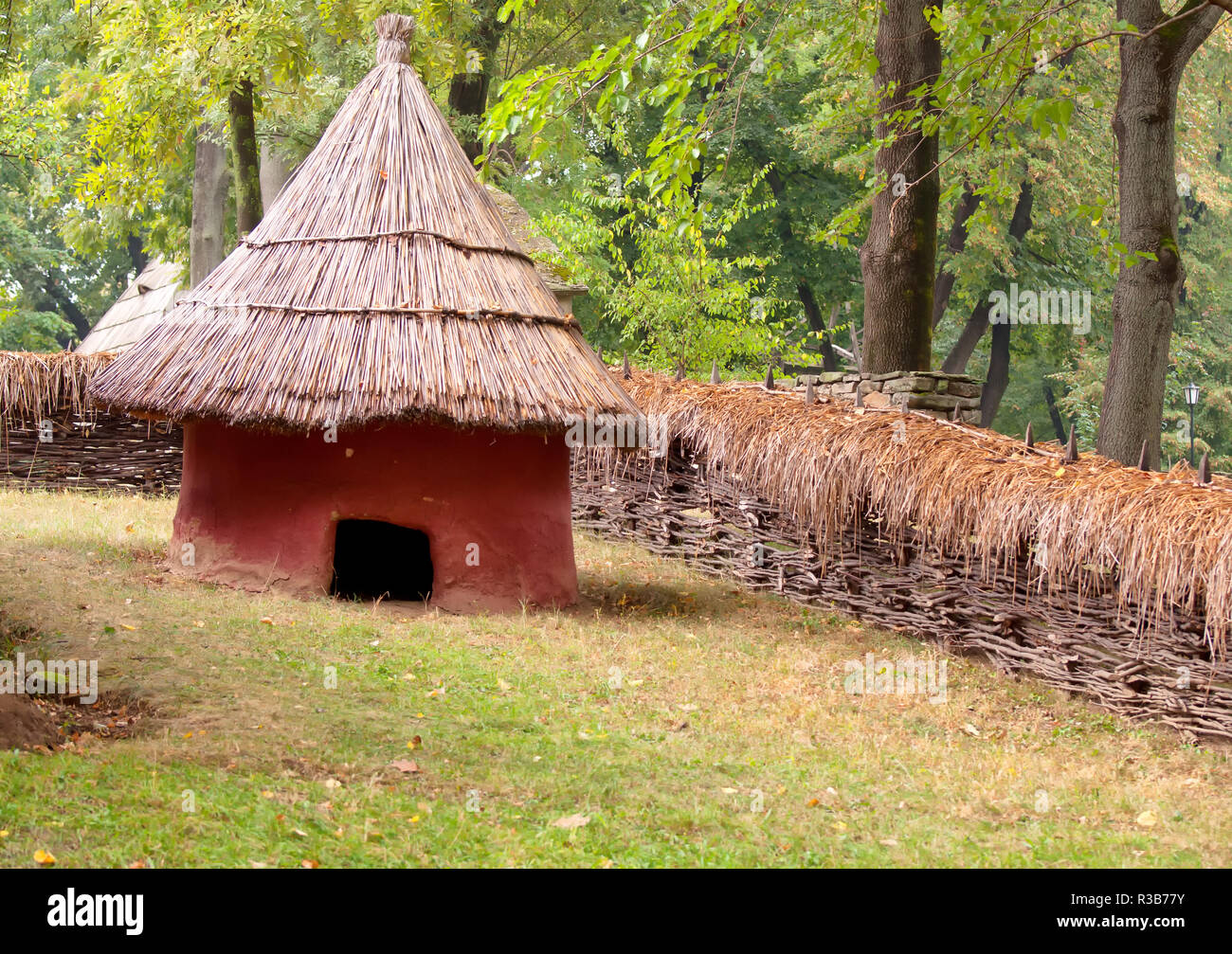 Mud hut with straw roof, fall picture Stock Photo