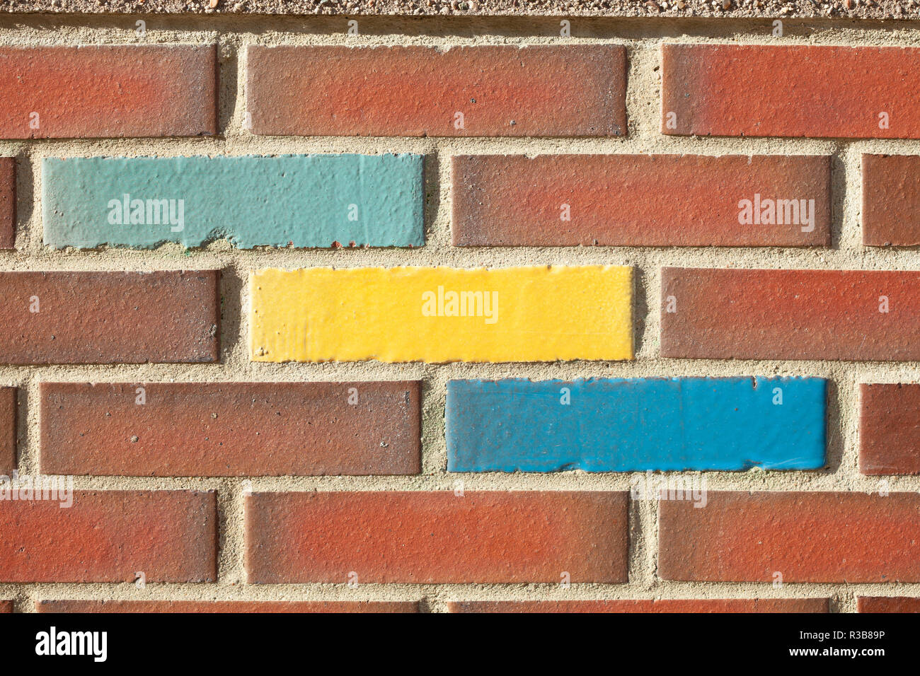 Coloured bricks in brick wall, Germany Stock Photo