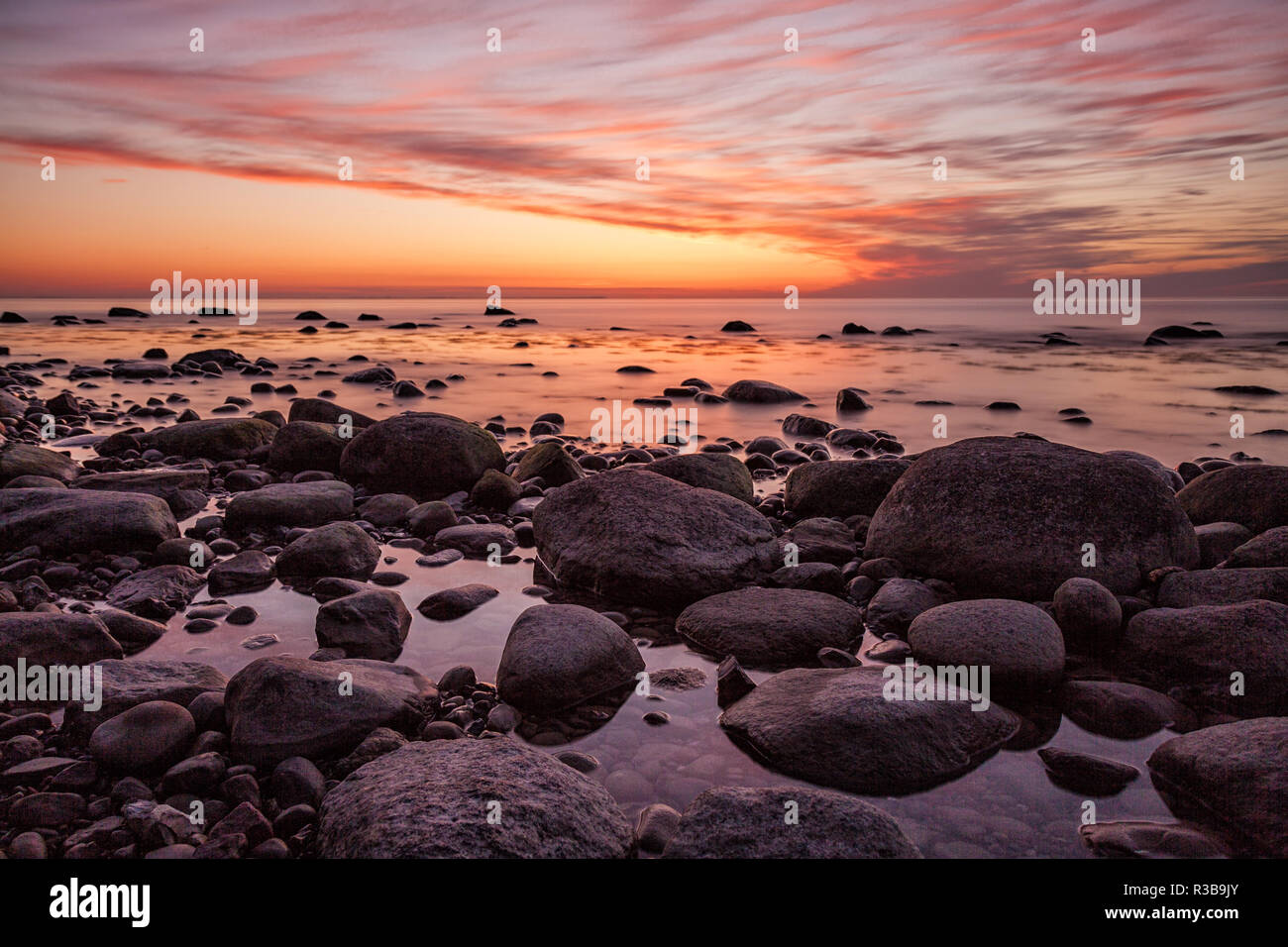 sunset on the baltic coast Stock Photo - Alamy